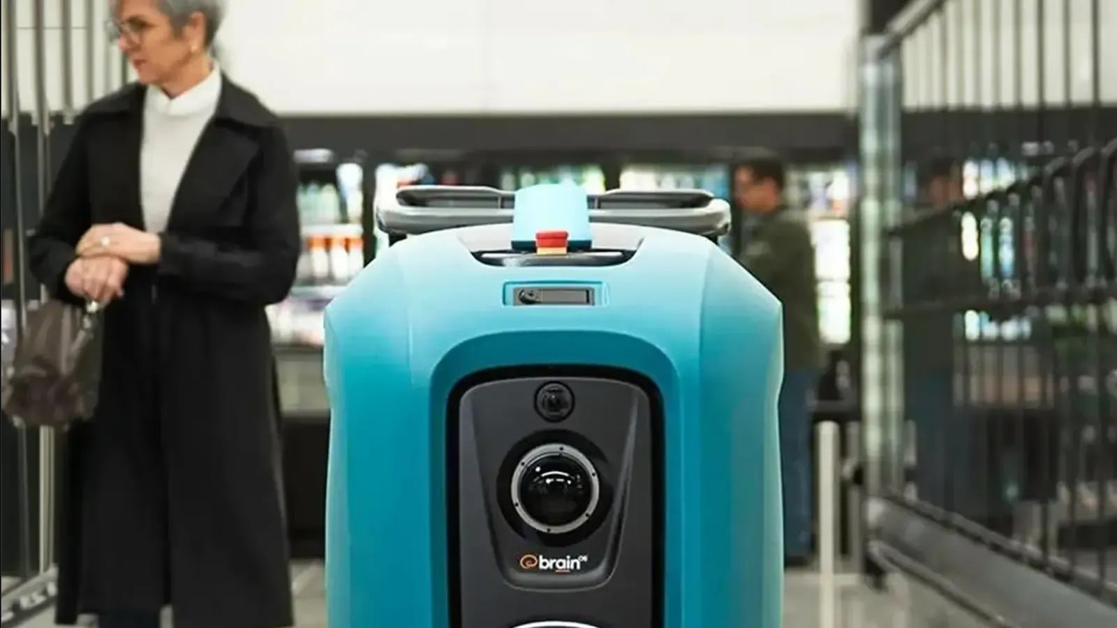 Robot mobile di servizio in corridoio commerciale con sensori frontali