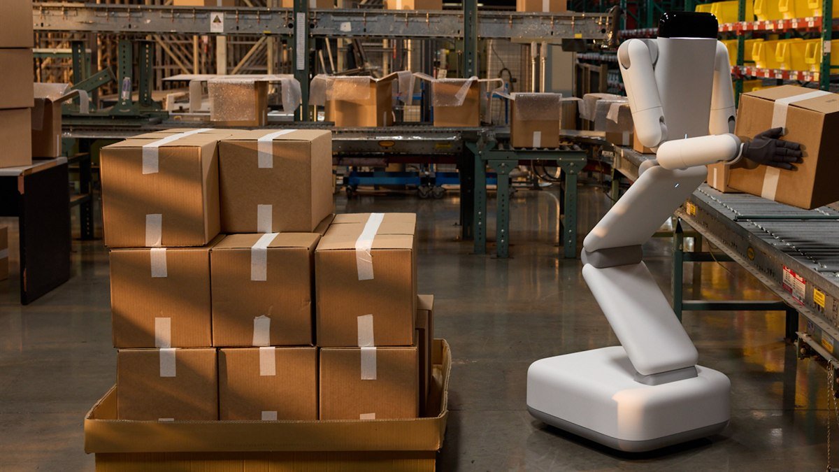 Robot Eno di Genesis AI vicino a scatole in un ambiente logistico
